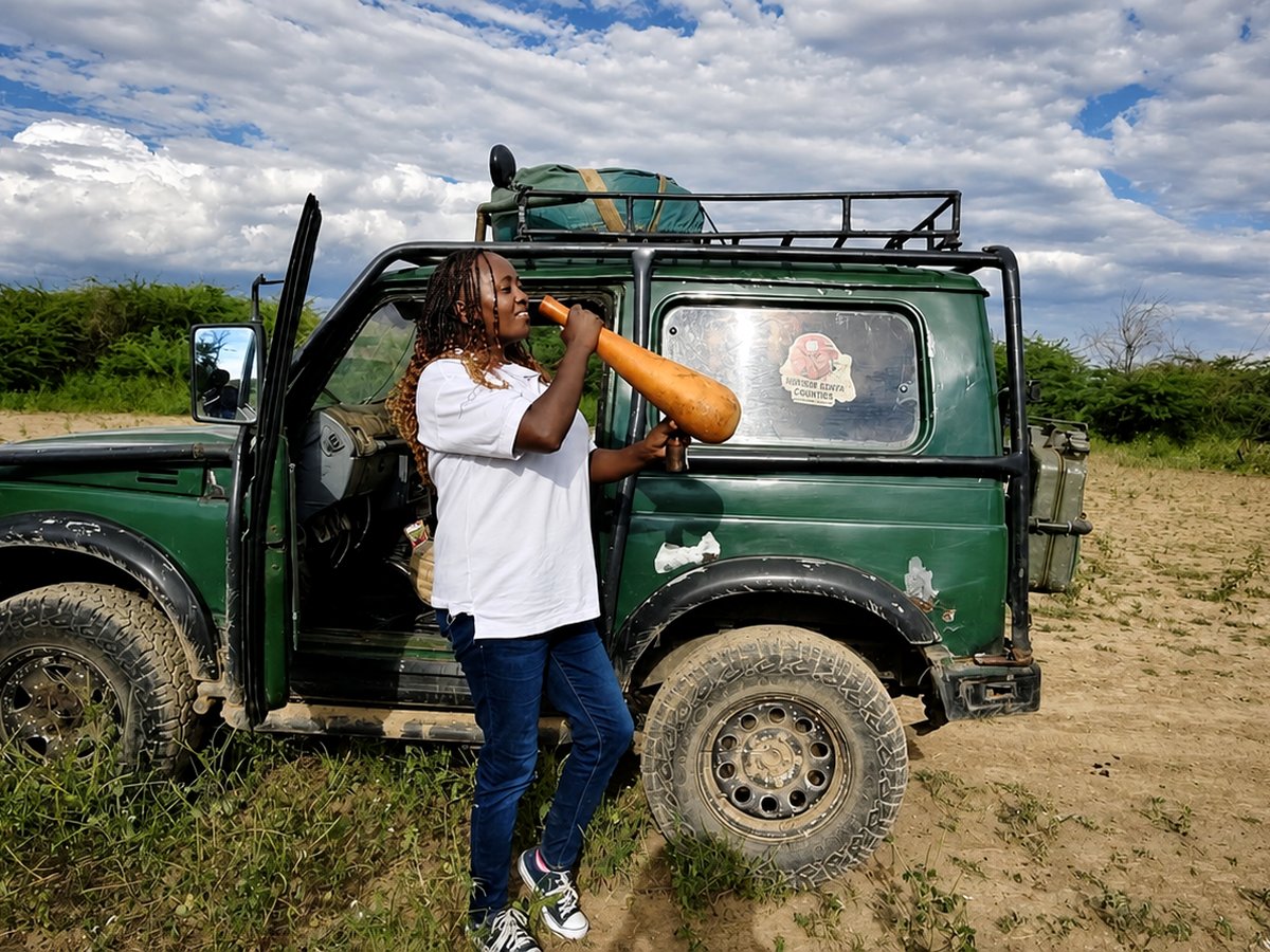 Safari vehicle and guide out on a game drive near Nguruman Waterfront Resort