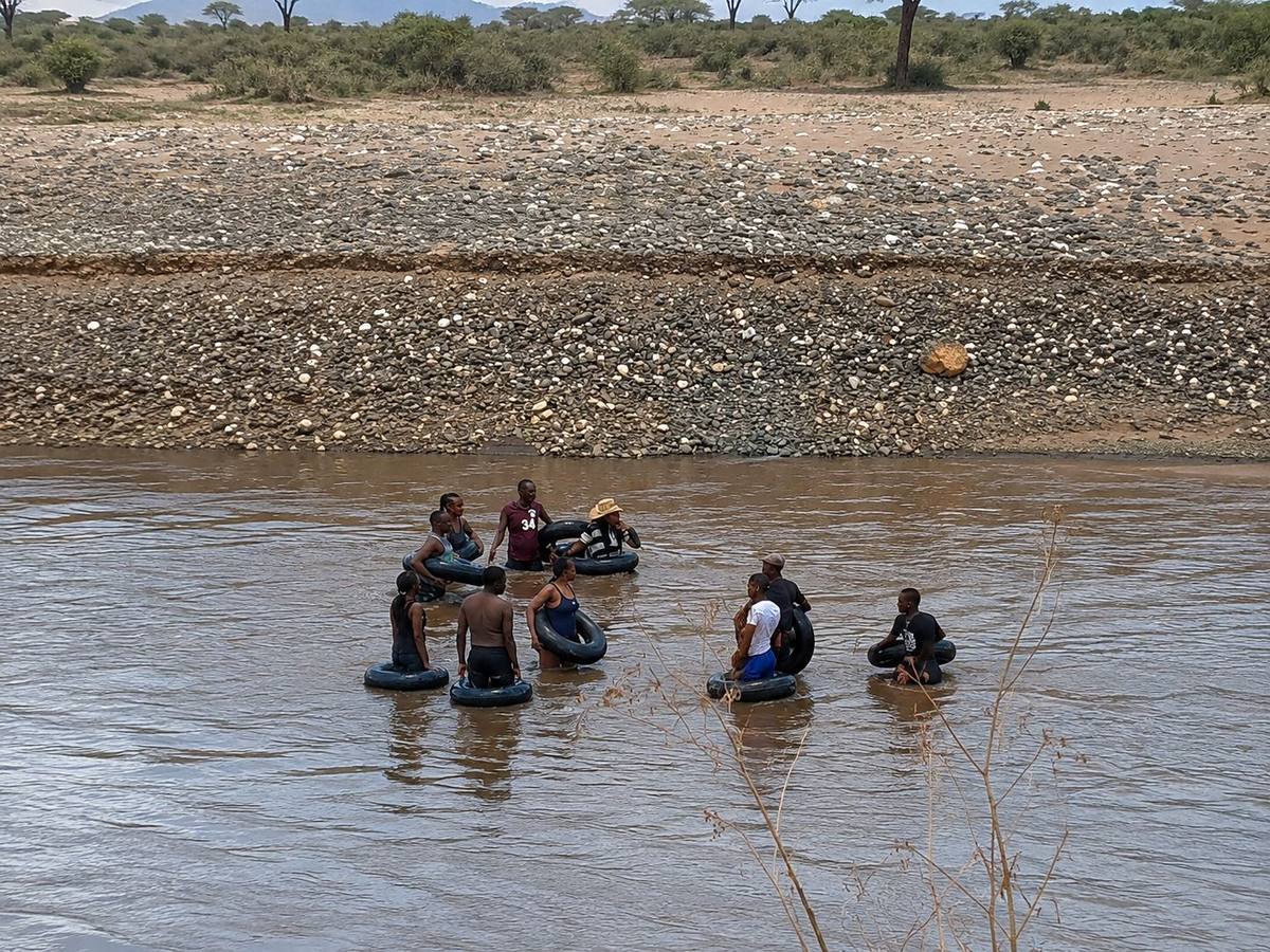 Guests floating down the Ewaso Ng'iro River on inner tubes