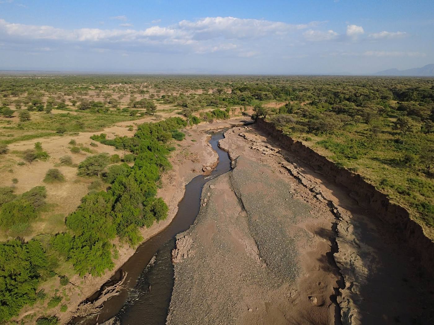 Aerial view of the river cutting through the savanna toward the escarpment